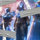 Pieces of duct tape hold together a ripped screenshot of Destiny 2 players.